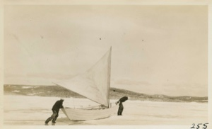 Image of Harold and Abram hauling dory over the ice
